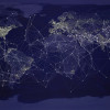 Artistic representation of a network across a night-view world map