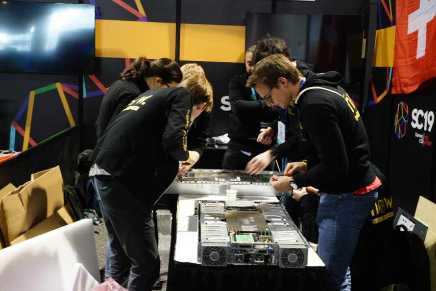 A team works on their project during the Student Cluster Competition at SC19, the last time the competition took place in person. (Credit: studentclustercompetition.us)