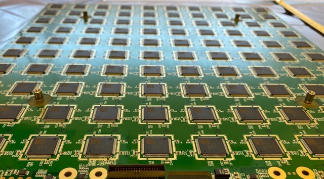 Application-Specific Integrated Circuits (ASICs) are attached to the back of a tile containing 4900 pixel sensors, which record the charges left behind by neutrinos passing through a liquid argon chamber. (Credit: Stefano Roberto Soleti, Berkeley Lab)