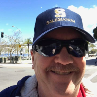 Michael Wehner wearing sunglasses and a baseball cap.