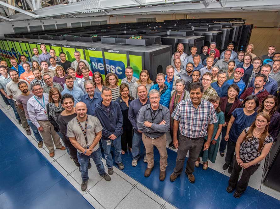 Group photo of NERSC personnel gathered around the CORI supercomputer in 2017