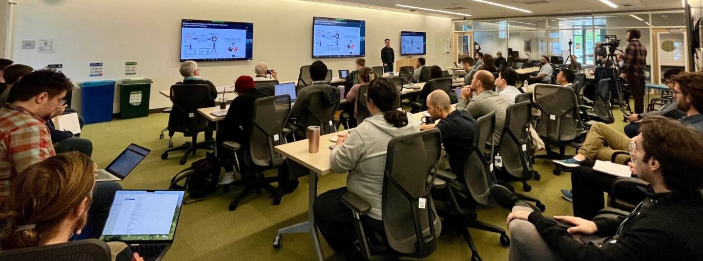 Dozens of people view a speaker during the 2024 postdoc symposium.