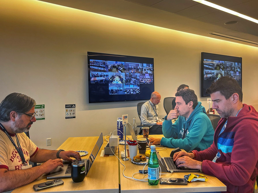 Participants consider AI prompts and results during the AI Jam event