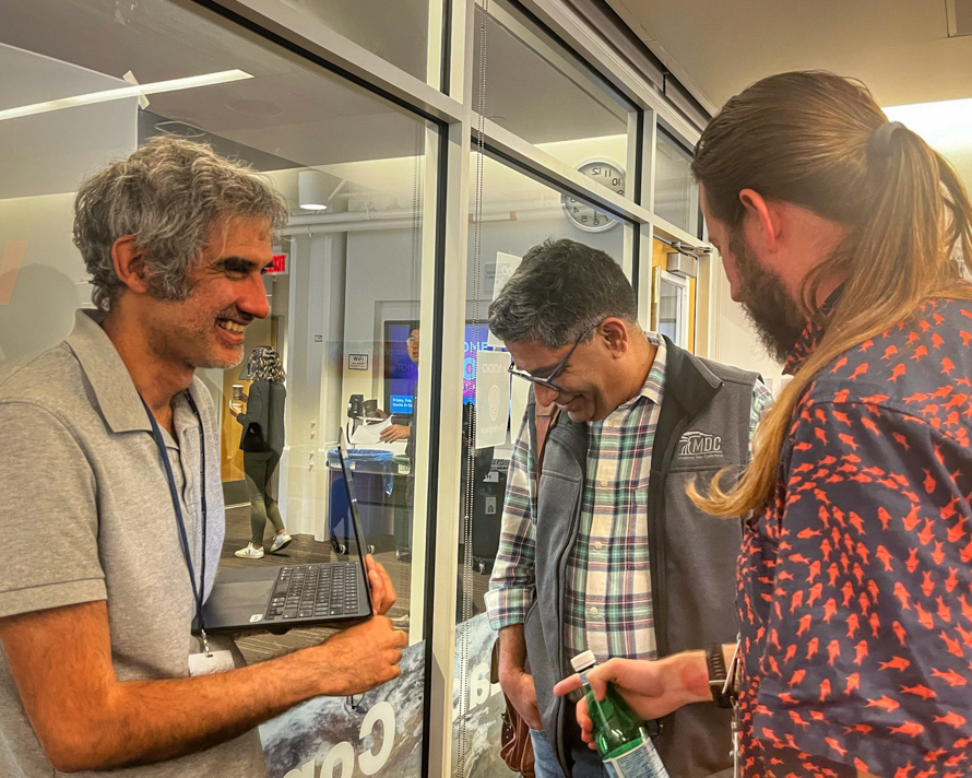 Wahid Bhimji and Johannes Blieschke chat during the AI Jam event.