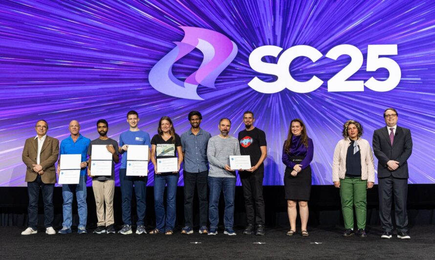 A group of individuals stands on a stage beneath a large "SC25" sign with a purple dynamic background; several people hold award certificates, and others stand in formal or business attire.