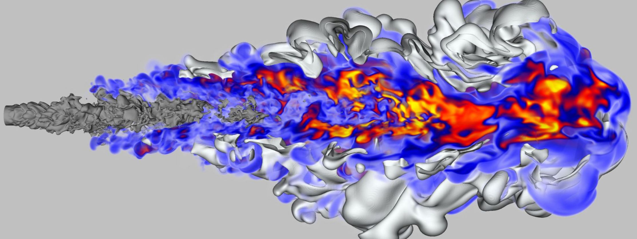 Simulation visualization of turbulent fluid flow, showing complex swirling structures in gray, with regions of high velocity or temperature highlighted in blue, red, and orange, spreading outward from a central jet on a light gray background.